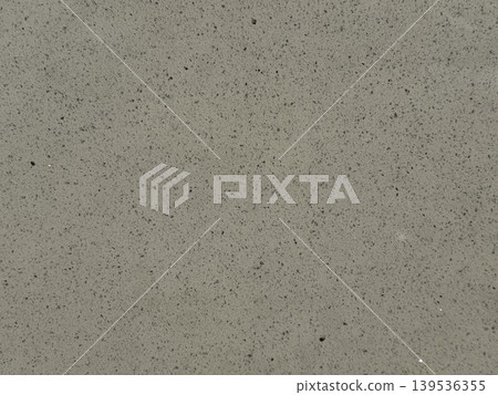 Concrete texture with small gray speckles, useful as industrial or construction background Concrete texture with small gray speckles, useful as industrial or construction background 139536355