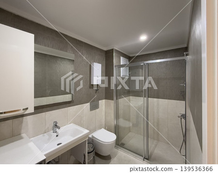 Modern bathroom with glass shower, large sink, and sleek fixtures, suitable for background Modern bathroom with glass shower, large sink, and sleek fixtures, suitable for background 139536366