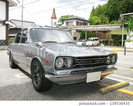 Driving an old car on a mountain road Driving an old car on a mountain road 139536435