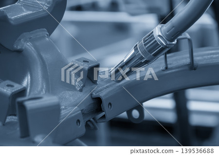 High-precision automotive parts assembly using an automated laser welding machine with a robotic arm system. High-precision automotive parts assembly using an automated laser welding machine with a robotic arm system. 139536688