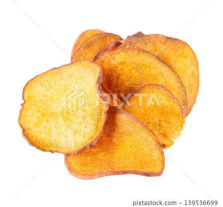 Crispy roasted sweet potato chips with sea salt, isolated on white background. Healthy and crunchy natural vegetable snack. Clipping path. 139536699