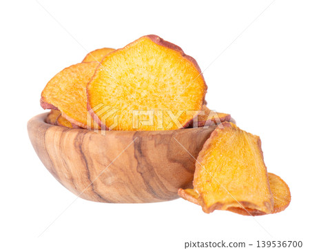 Crispy roasted sweet potato chips with sea salt, isolated on white background. Healthy and crunchy natural vegetable snack. Clipping path. 139536700