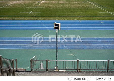 The goalposts of the rugby field as seen across the blue athletics track. The goalposts of the rugby field as seen across the blue athletics track. 139537406
