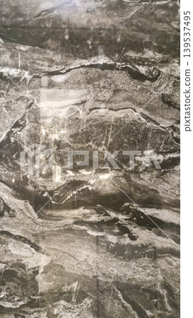 Black Italian marble texture with gold and white vein patterns. Black Italian marble texture with gold and white vein patterns. 139537495