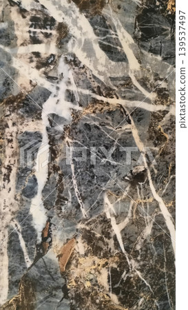 Dark grey marble with artistic white and purple veins. 139537497