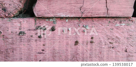 Old wood texture painted pink with a weathered and cracked effect. Old wood texture painted pink with a weathered and cracked effect. 139538017