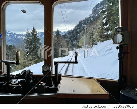 [Switzerland] Snow-covered Alpine scenery viewed from the window of the Rigi Railway train. 139538066