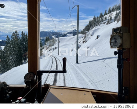[Switzerland] Snow-covered Alpine scenery viewed from the window of the Rigi Railway train. 139538068