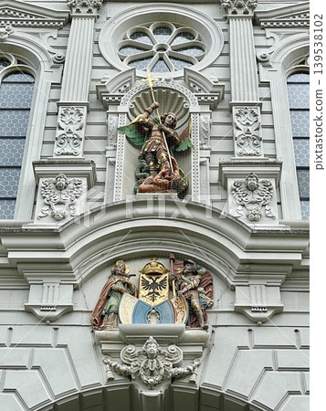 [Switzerland] Saint sculptures and decorative architecture on the exterior walls of the Hofkirche (Church of Saints). 139538102