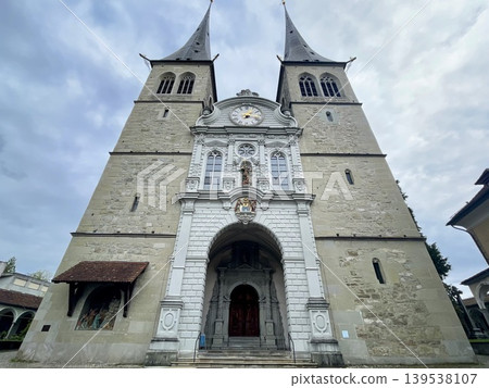 [Switzerland] Exterior view of the Hofkirche in Lucerne and its twin towers 139538107