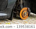 Detailed view of rusty car brake system and rotor 139538161