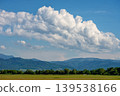 Scenic mountain landscape under white cumulus clouds 139538166