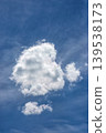 Single white cloud in blue sky vertical view 139538173