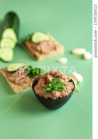 homemade liver pate on bread with green background homemade liver pate on bread with green background 139538413