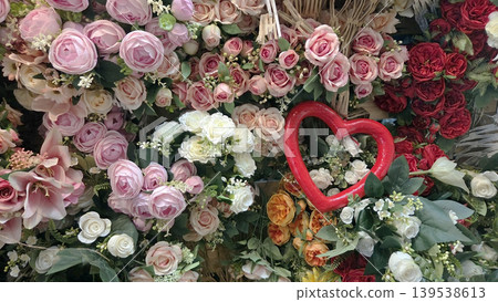 Assorted pink and red roses bouquet with heart decoration for romantic floral background and valentines banner design Assorted pink and red roses bouquet with heart decoration for romantic floral background and valentines banner design 139538613