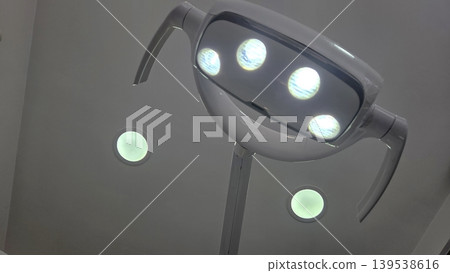 Overhead dental operatory ceiling light lamp for clinic examination background and medical treatment room design Overhead dental operatory ceiling light lamp for clinic examination background and medical treatment room design 139538616