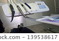 Patient view of dental handpieces on a delivery unit with control panel in an exam room for healthcare brochure background and banner design 139538617