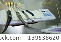 Closeup of dental handpieces and instruments on a clinic delivery unit for medical brochure background and banner design 139538620