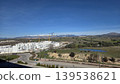Suburban housing development with construction cranes and green landscape near pond for planning background and environmental design 139538621
