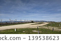 Rural dirt road and open field landscape with snowcapped mountains and blue sky for nature background and outdoor wallpaper 139538623