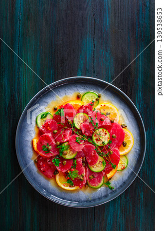 Sicilian tuna crudo, on a plate, wooden background,italian dish, homemade, no people, Sicilian tuna crudo, on a plate, wooden background,italian dish, homemade, no people, 139538653