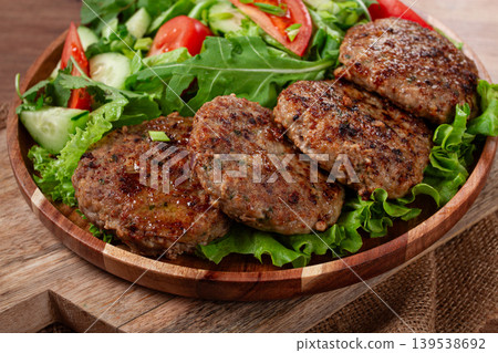 Fried cutlets, mixed minced meat, with vegetable salad, homemade, top view, no people, Fried cutlets, mixed minced meat, with vegetable salad, homemade, top view, no people, 139538692