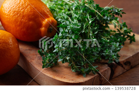 lemon thyme, on a wooden chopping board, with lemons, close-up, lemon thyme, on a wooden chopping board, with lemons, close-up, 139538728
