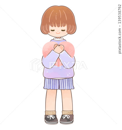 A little girl smiling while holding a heart. 139538762