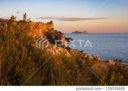 Rugged coastal cliffs overlooking the mediterranean sea at sunset Rugged coastal cliffs overlooking the mediterranean sea at sunset 139538888