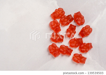 Jelly gummy bear fruit vitamins on bright background, food supplements.Vitamins candies with copy space Jelly gummy bear fruit vitamins on bright background, food supplements.Vitamins candies with copy space 139539503