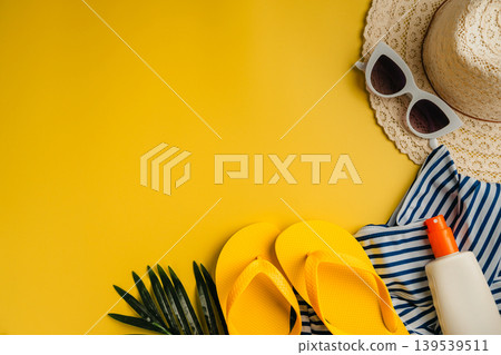 Summer holiday flat lay yellow background. Beach travel accessories for vacation. Sunglasses, sun hat, sunscreen. Copy space Summer holiday flat lay yellow background. Beach travel accessories for vacation. Sunglasses, sun hat, sunscreen. Copy space 139539511