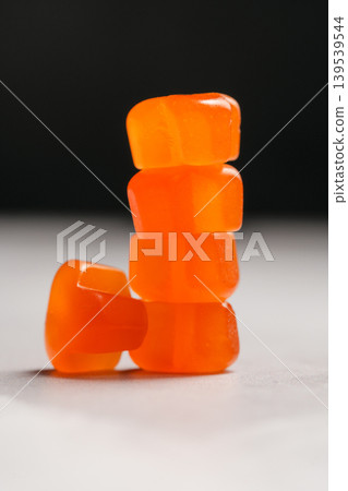 Jelly gummy fruit vitamins, food supplements.Orange vitamins stack Jelly gummy fruit vitamins, food supplements.Orange vitamins stack 139539544