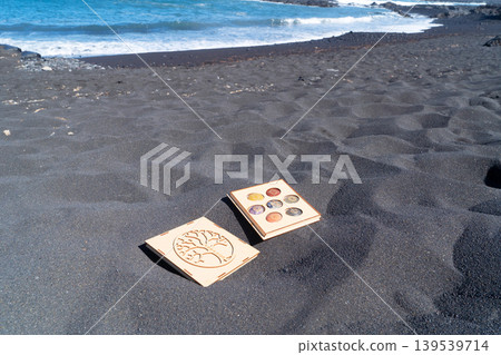 Healing crystals on black sand background Healing crystals on black sand background 139539714