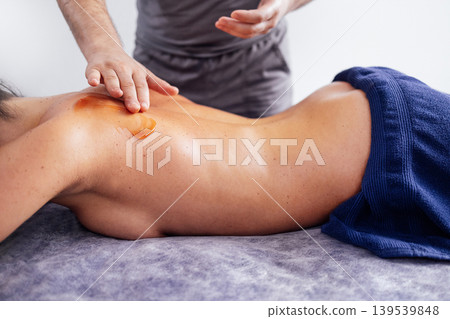 Asian woman receiving a relaxing massage with aromatic oil in a serene spa environment, showcasing tranquility and wellness through professional therapy techniques Asian woman receiving a relaxing massage with aromatic oil in a serene spa environment, showcasing tranquility and wellness through professional therapy techniques 139539848