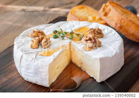 Creamy Camembert Cheese With Maple Syrup Walnuts And Toasted Baguette Slices 139540002