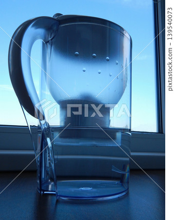 The process of water filtration in a domestic water filter The process of water filtration in a domestic water filter 139540073