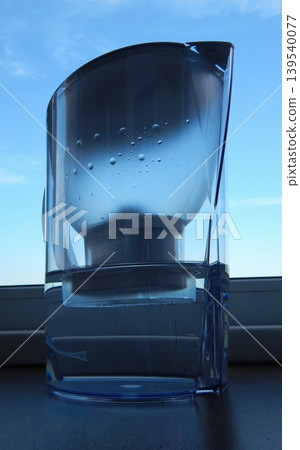 Clear Water Filter Pitcher On Windowsill Clear Water Filter Pitcher On Windowsill 139540077