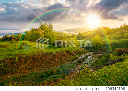 foggy sunset over carpathian mountain landscape. outdoor adventure with stunning view in evening light. countryside landscape with rolling hills, fog and cloudy sky. weather with rainbow foggy sunset over carpathian mountain landscape. outdoor adventure with stunning view in evening light. countryside landscape with rolling hills, fog and cloudy sky. weather with rainbow 139540108