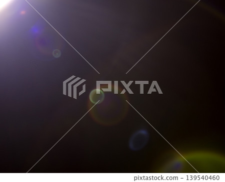 Abstract image featuring colorful lens flares and light reflections against a dark background, creating a visually striking and dynamic composition of light and color Abstract image featuring colorful lens flares and light reflections against a dark background, creating a visually striking and dynamic composition of light and color 139540460
