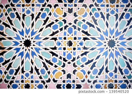 Intricate geometric pattern featuring vibrant colors and symmetrical designs, showcasing traditional craftsmanship and artistic expression in decorative tile work Intricate geometric pattern featuring vibrant colors and symmetrical designs, showcasing traditional craftsmanship and artistic expression in decorative tile work 139540520