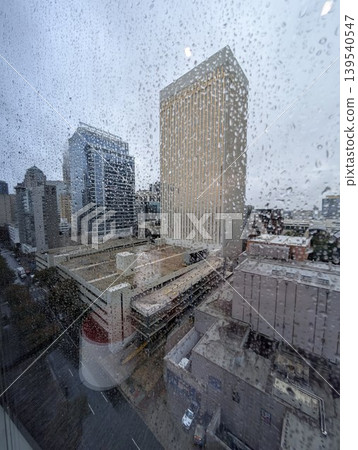 Charlotte Skyline Dissolving Softly Beyond Rain Covered Window Glass Downtown Charlotte Skyline Dissolving Softly Beyond Rain Covered Window Glass Downtown 139540547
