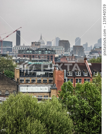 Elevated Urban Cityscape with Railway Tracks Dense Residential Buildings and Modern Metropolitan Elevated Urban Cityscape with Railway Tracks Dense Residential Buildings and Modern Metropolitan 139540559
