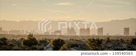 Las Vegas Nevada Skyline with Stratosphere Tower and Desert Mountain Backdrop from Daylight Las Vegas Nevada Skyline with Stratosphere Tower and Desert Mountain Backdrop from Daylight 139540563