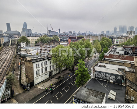 Elevated Urban Cityscape with Railway Tracks Dense Residential Buildings and Modern Metropolitan Elevated Urban Cityscape with Railway Tracks Dense Residential Buildings and Modern Metropolitan 139540568