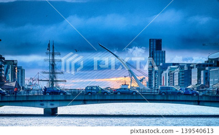 Samuel Beckett Bridge and Jeanie Johnston Famine Ship in Dublin Ireland at Sunrise at River Liffey  139540613