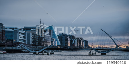 Samuel Beckett Bridge and Convention Centre Dublin Ireland at Sunrise with River Liffey Samuel Beckett Bridge and Convention Centre Dublin Ireland at Sunrise with River Liffey 139540618