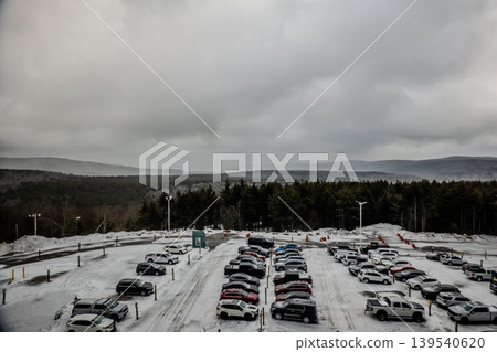 Snowshoe West Virginia Ski Resort ParkingLot Covered in Snow with Cars Forest and Mountain Landscape Snowshoe West Virginia Ski Resort ParkingLot Covered in Snow with Cars Forest and Mountain Landscape 139540620