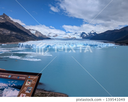 Los Glaciares National Park, Santa Cruz Province, Argentina - March 10, 2026: Map of the Perito Moreno Glacier and view of the glacier. Los Glaciares National Park, Santa Cruz Province, Argentina - March 10, 2026: Map of the Perito Moreno Glacier and view of the glacier. 139541049