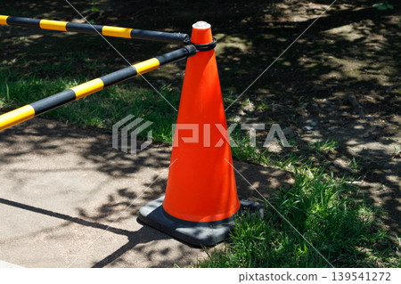 A traffic cone installed at a construction site A traffic cone installed at a construction site 139541272