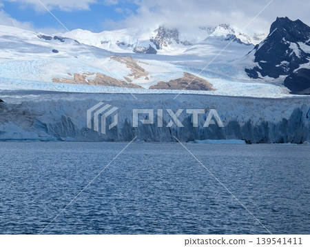 Snow-capped Andes and Perito Moreno Glacier in Santa Cruz Province, Argentina, during cloudy weather. Snow-capped Andes and Perito Moreno Glacier in Santa Cruz Province, Argentina, during cloudy weather. 139541411